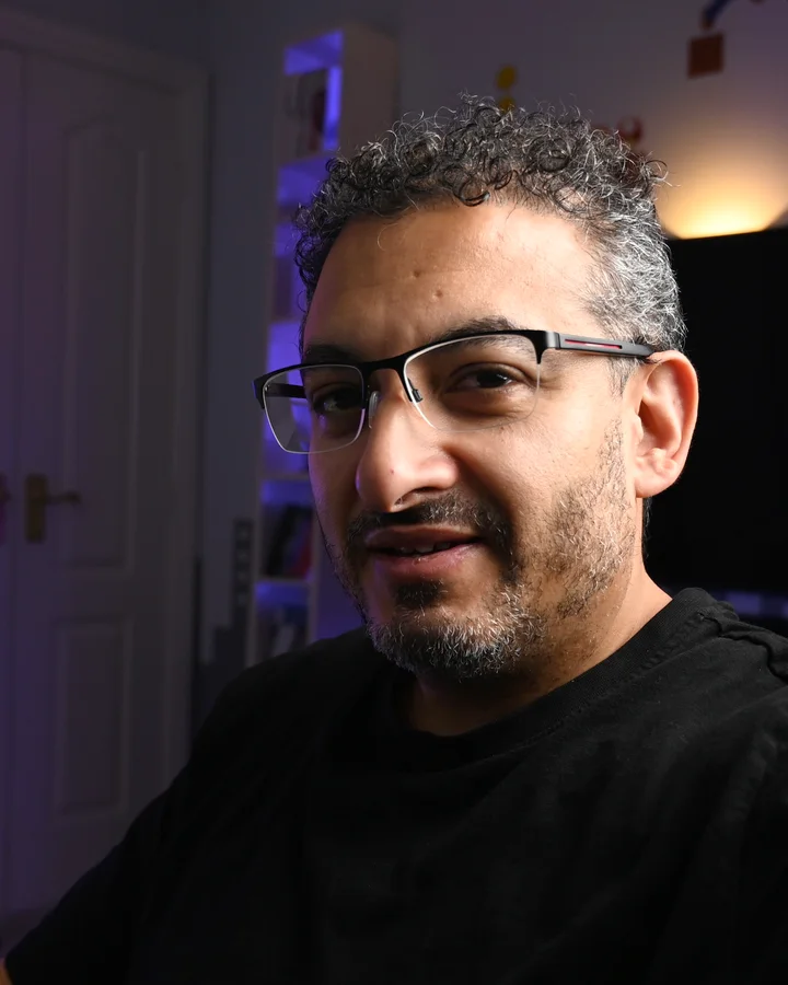 Munty at his desk in the studio, looking at the camera
